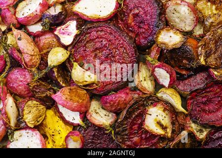 roasted root vegetables including beets and radishes Stock Photo
