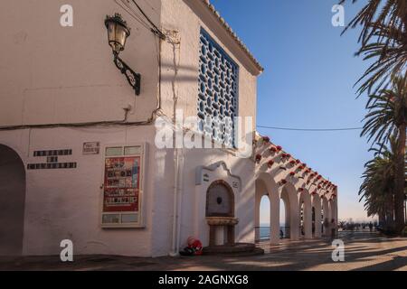 Historic house in Nerja on the street to the view Balcon of Europe. House with arches and flower Stock Photo