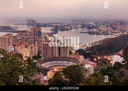 View of the center of the Spanish city of Malaga on the Mediterranean coast. View of the city on the Costa del Sol in the evening with illuminated Stock Photo