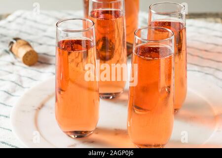 Sparkling Red Rose Champagne in a Glass Stock Photo