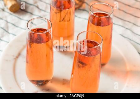 Sparkling Red Rose Champagne in a Glass Stock Photo