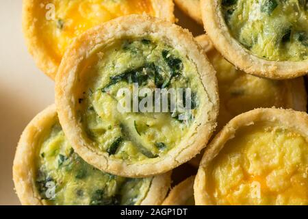 Homemade Mini Egg Quiches with Spinach and Feta Stock Photo