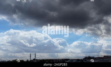 Silhouettes of two muslim minarets on a background of a beautiful cloudy sky. Allah sends the rays of the sun to the blessed earth. Islam religion, be Stock Photo