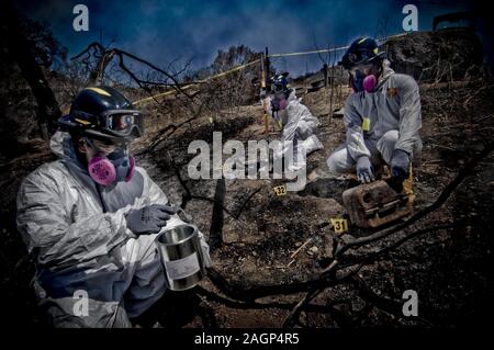 FBI Evidence Response Team Members collecting evidence at a crime scene. Stock Photo