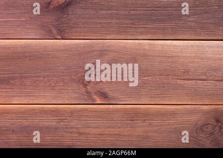 Wood texture in warm golden and brown tones. Old rural wooden wall, detailed plank fence photo background. Natural wooden building structure Stock Photo