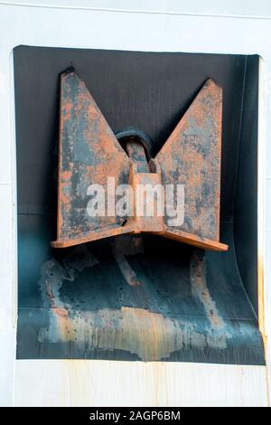 A huge anchor stowed away on a large cargo ship/ Stock Photo