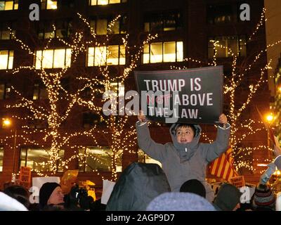 Chicago, Illinois, USA. 17th December 2019. Protesters rally in Federa Plaza, then march to Trump Tower demanding impeachment of President Trump. Stock Photo