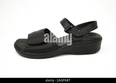 Black Leather Sandal with wedge Heel Stock Photo