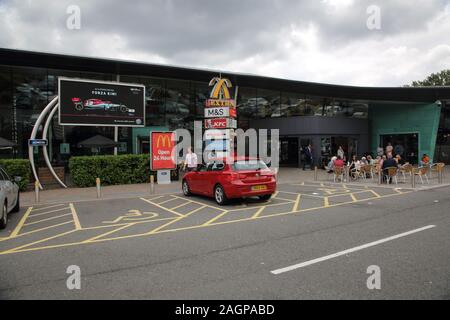 Beaconsfield Service Station on M40 Buckinghamshire England People Sitting in cafe outside Stock Photo