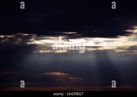 black clouds and sun rays Stock Photo