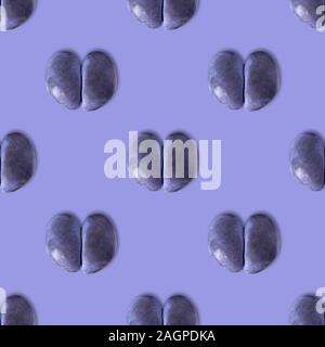 Seamless pattern with ugly plum on purple background. Tropical abstract background. Ugly food. Stock Photo