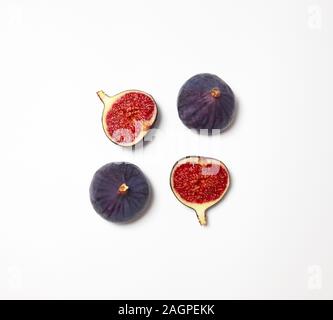 Fresh figs isolated on white background. Food Photo. Purple figs with red seeds. Flat lay, top view. Stock Photo