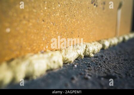 Worker is using a polyurethane foam for installation of window sill Stock  Photo - Alamy