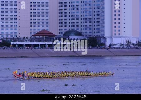 Dragon boat racing on The Tonle Sap River during the Cambodian Water Festival. The Sokha Hotel in background. Phnom Penh, Cambodia. © Kraig Lieb Stock Photo