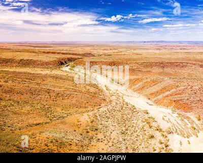 A dry creek bed downstream of Glen Helen Gorge, West MacDonnell Ranges, Northern Territory, Australia Stock Photo