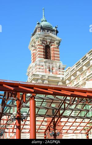 NEW YORK, NY - 04 NOV 2019: Closeup detail  of the Entrance canopy and tower atop the Main Building at Ellis Island National Museum of Immigration. Stock Photo