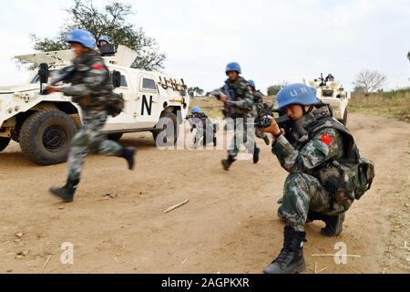 (191220) -- NEW YORK, Dec. 20, 2019 (Xinhua) -- Members of China's 5th peacekeeping infantry battalion to South Sudan take a military exercise in South Sudan, on Jan. 4, 2019. Unilateralism and protectionism have been eroding the global governance system throughout 2019, prompting widespread concern among members of the international community. Braving such headwinds, China has been doing its utmost to defend multilateralism, via concrete actions such as paying in full all it owes for the 2019 UN regular budget, actively participating in climate action, strongly backing UN peacekeeping operati Stock Photo