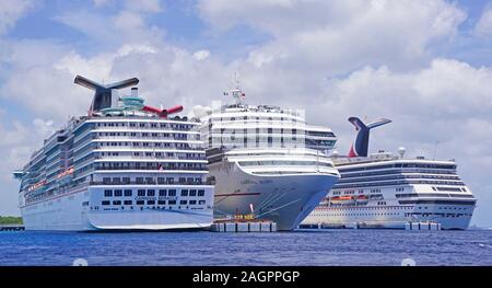 Trio of Carnival Cruise Line ships at Cozumel, Mexico. Stock Photo