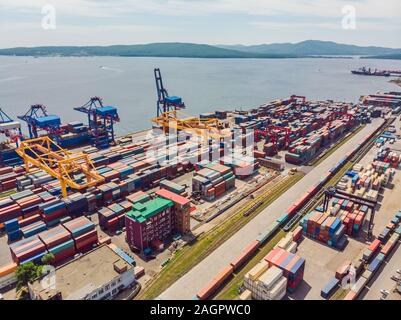 Container ship in import export and business logistic, By crane, Trade Port, Shipping cargo to harbor, Aerial view from drone, International