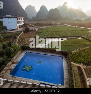 Yangshuo, China  - November 7, 2019: Sunrise over the countryside in Yangshuo, Guanxi province Stock Photo