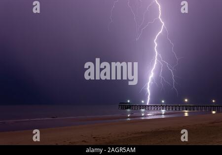 Big lightning bolt strike over Henley beach Stock Photo