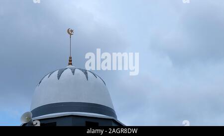 Miri, Malaysia - November 16, 2019: Close up of the dome of a mosque in Miri, with cloudy gloomy sky in the background. Stock Photo