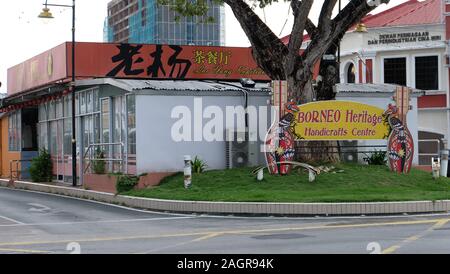 Miri, Malaysia - November 16, 2019: Street in Miri, with a large signboard written 'Borneo Heritage Handcrafts Centre'. Stock Photo