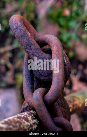 metal rod, old rust tube, connection chain for fastening in metal steel industry, metal rod as handrail, old and rust for joints and fastening, suitab Stock Photo