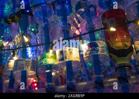 Lighted plastic bottles used in a large-scale recycled sculpture for Jacksonville Beach's holiday season public art event, Deck the Chairs. Stock Photo