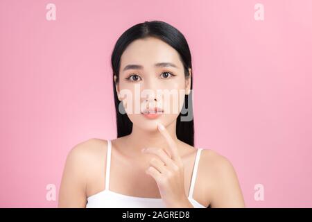 Young Asian woman touch and worry about her face. Acne, pimple, clear and  clean, oily, dry skin concept Stock Photo - Alamy