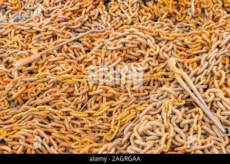 pile of rusty old cast iron chains in a forge at the Black Country Living Museum, Tipton, Birmingham West Midlands Stock Photo