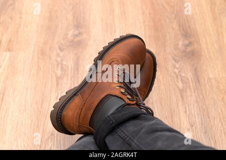 Photo of a brand new brown stylish winter boots Stock Photo