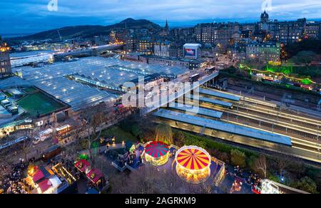 Dusk view of Waverley Station and skyline Edinburgh Old Town in winter, Scotland, UK Stock Photo