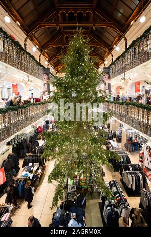 view of Christmas tree and decorations in atrium of Jenners department store on Princes Street in Edinburgh, Scotland, Uk Stock Photo