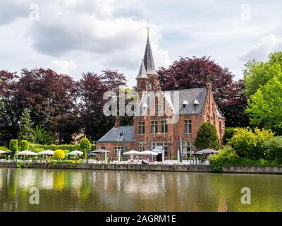 Castle della Faille along Minnewater lake in old town of Bruges, Belgium Stock Photo