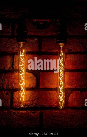 Modern, vintage style light bulbs in a dark public house Stock Photo