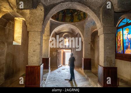 interior of a cave church with carved christian symbols of Byzantine civility in the underground city of Guzelyurt - Cappadocia, Turkey Stock Photo