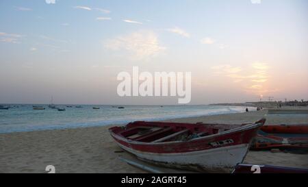 Santa Maria, Sal / Cape Verde - 19. November, 2015: colorful wooden fishing boats on the beach in Sal in Cape Verde at sunset Stock Photo