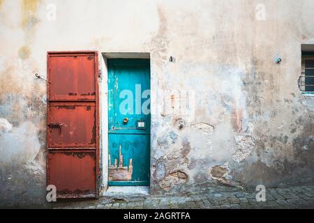 Doors blue and red, old building front view Stock Photo