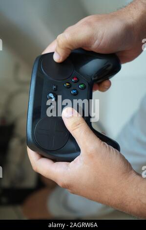 Steam Controller by Valve with its original box in its original state before being discontinued Stock Photo