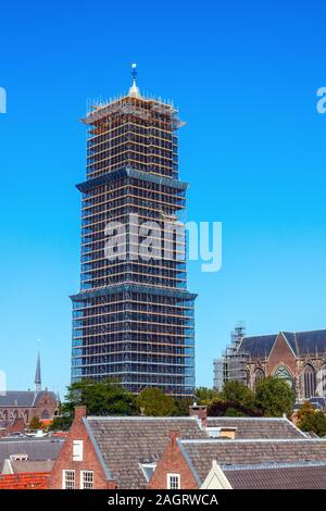 Saint Martins Cathedral Dom Tower on a sunny day, completely surrounded by scaffolding due to renovation work. Utrecht, The Netherlands. Stock Photo
