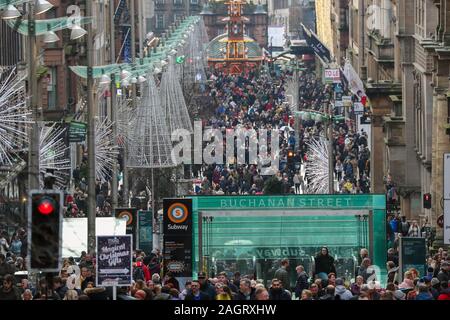 Glasgow, UK. 21 December 2019. On the last shopping Saturday before Christmas, thousands of customers flock to Glasgow City centre to enjoy the street entertainment provided by Govan branch of the Salvation Army, the international foods at the Street markets and the many executive shops in Buchanan Street, known as Glasgow's 'Style Mile'.  Credit: Findlay / Alamy News Stock Photo