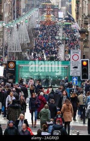 Glasgow, UK. 21 December 2019. On the last shopping Saturday before Christmas, thousands of customers flock to Glasgow City centre to enjoy the street entertainment provided by Govan branch of the Salvation Army, the international foods at the Street markets and the many executive shops in Buchanan Street, known as Glasgow's 'Style Mile'.  Credit: Findlay / Alamy News Stock Photo