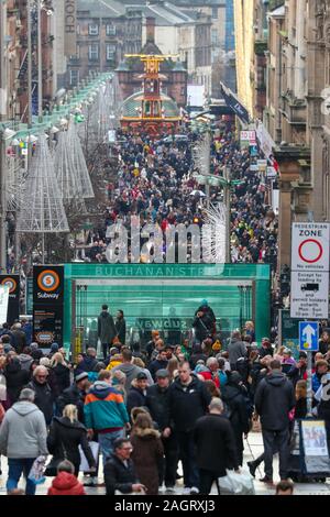 Glasgow, UK. 21 December 2019. On the last shopping Saturday before Christmas, thousands of customers flock to Glasgow City centre to enjoy the street entertainment provided by Govan branch of the Salvation Army, the international foods at the Street markets and the many executive shops in Buchanan Street, known as Glasgow's 'Style Mile'.  Credit: Findlay / Alamy News Stock Photo