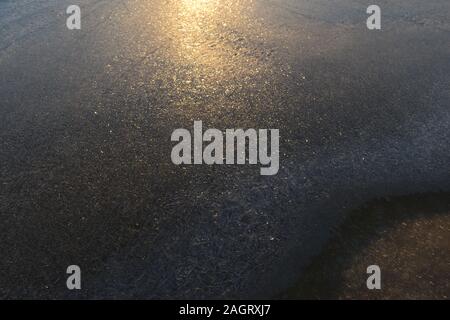 Ice pattern in shadow and sunlight in a winter morning on the frozen Baltic Sea Stock Photo