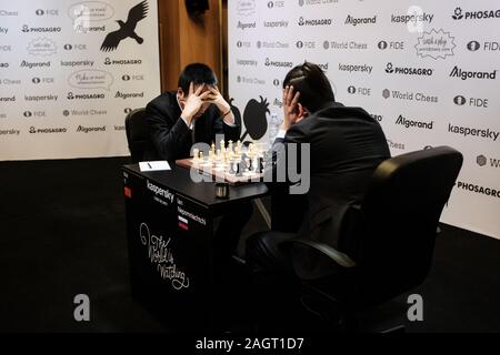 Jerusalem, Israel. 14th December, 2019. WESLEY SO (L), 27, of the USA,  competes with IAN NEPOMNIACHTCHI (R), 29, of Russia, in Round 2, Game 1, of  the final leg of the World