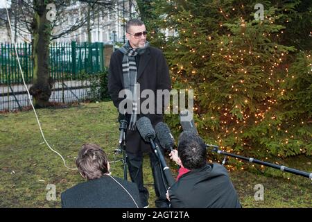 George Michael arrives back in 2011 at his home in Highgate after spending a month in Hospital in Austria with influenza. Stock Photo