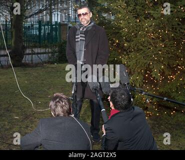 George Michael arrives back in 2011 at his home in Highgate after spending a month in Hospital in Austria with influenza. Stock Photo