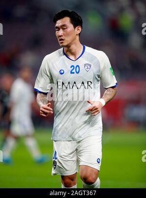 Al Hilal's Ali Al Bulayhi, right, fights for the ball with Urawa