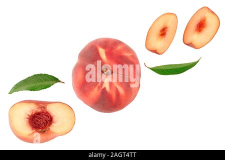 Ripe chinese flat peach fruit and half with leaf isolated on white background with copy space for your text. . Top view. Flat lay. Stock Photo